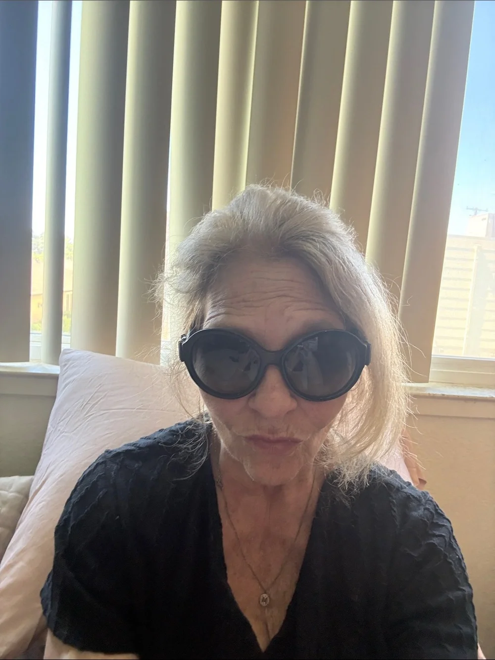 CHANEL Black Oversized Round Women's Sunglasses with iconic bows on each side.